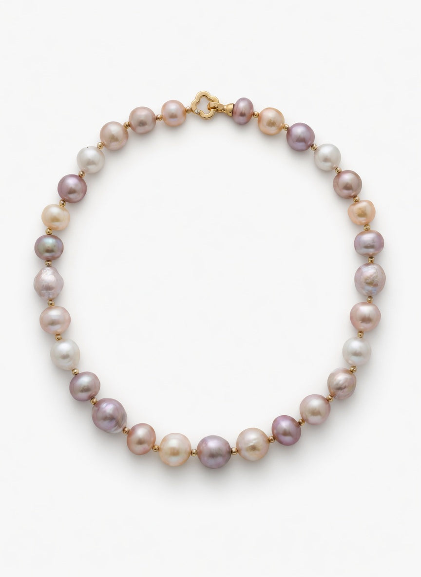 Pearl necklace with gold clasp on a white background