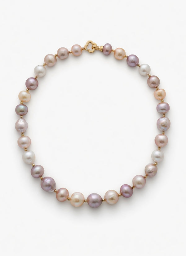 Pearl necklace with gold clasp on a white background